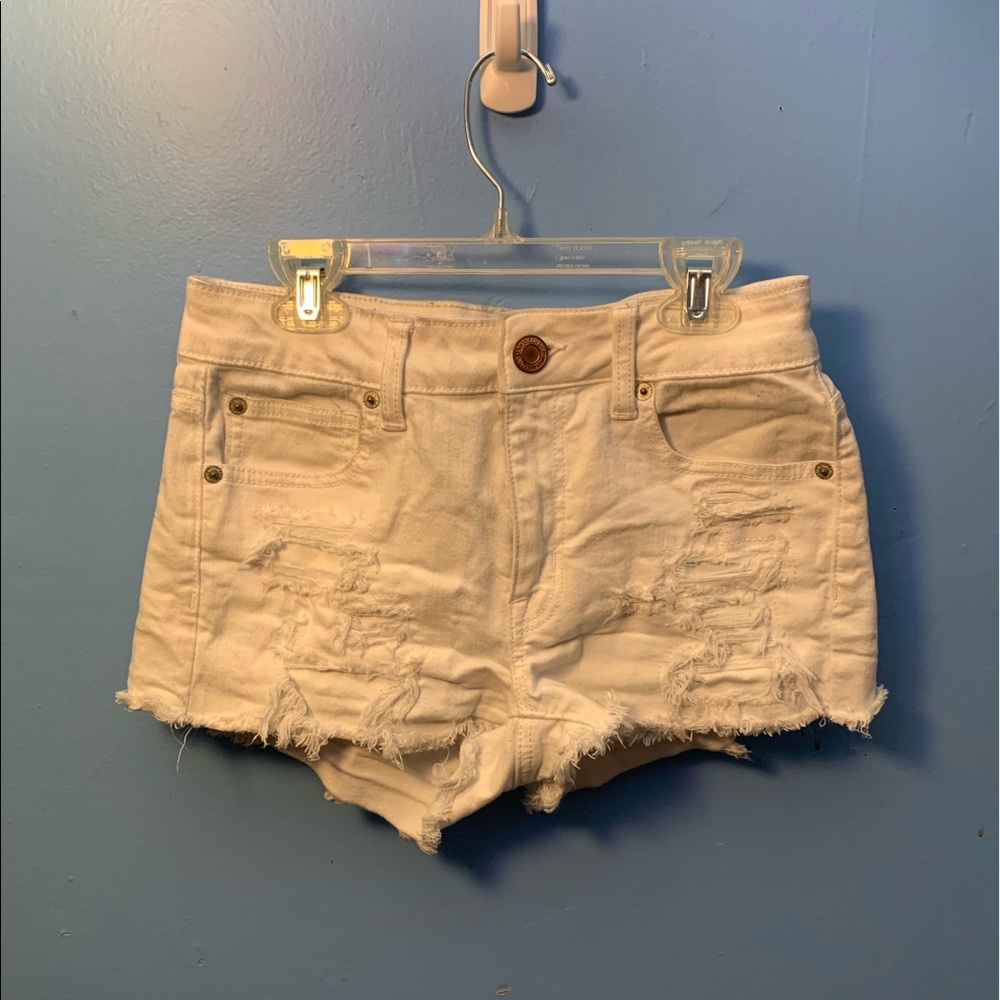 White ripped shorts